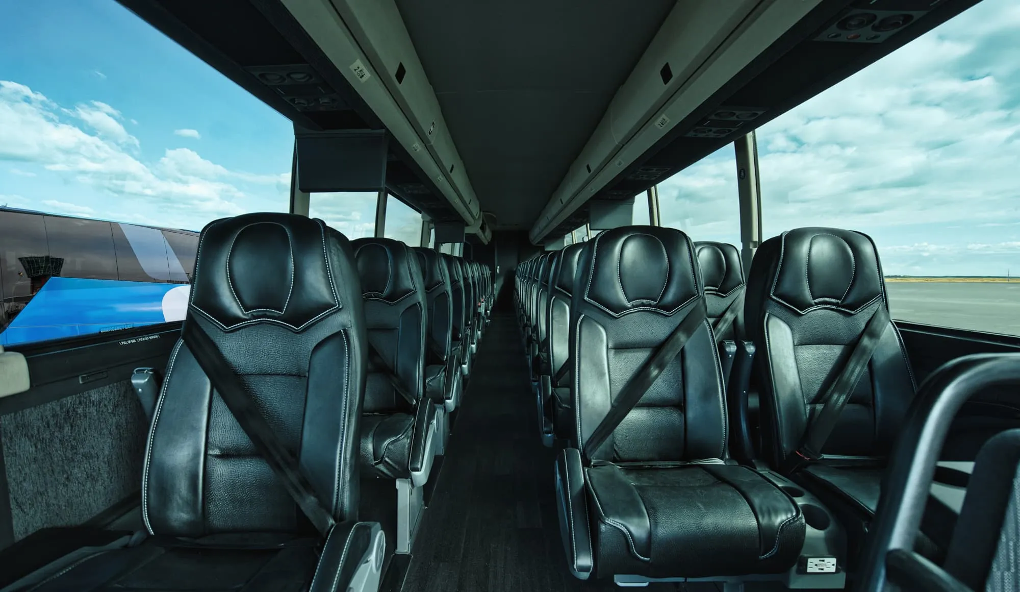 The cabin of a Landline coach, seats in a two-by-one layout