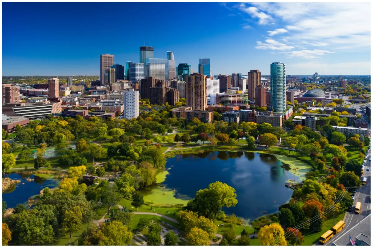 Aerial view of downtown Minneapolis, with Loring Park and its pond in the foreground.